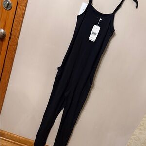 Black Spaghetti Strap jumpsuit.  its a size XS, will fit a size small as well.